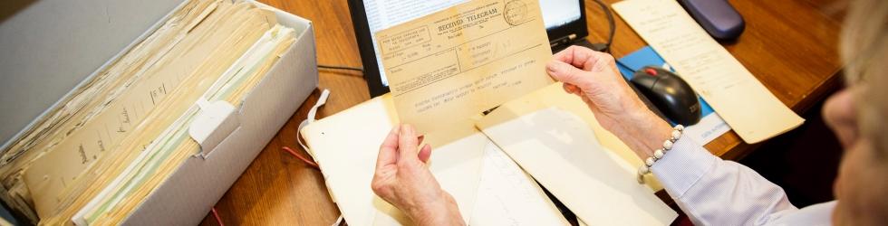 Archivist with archival artefact